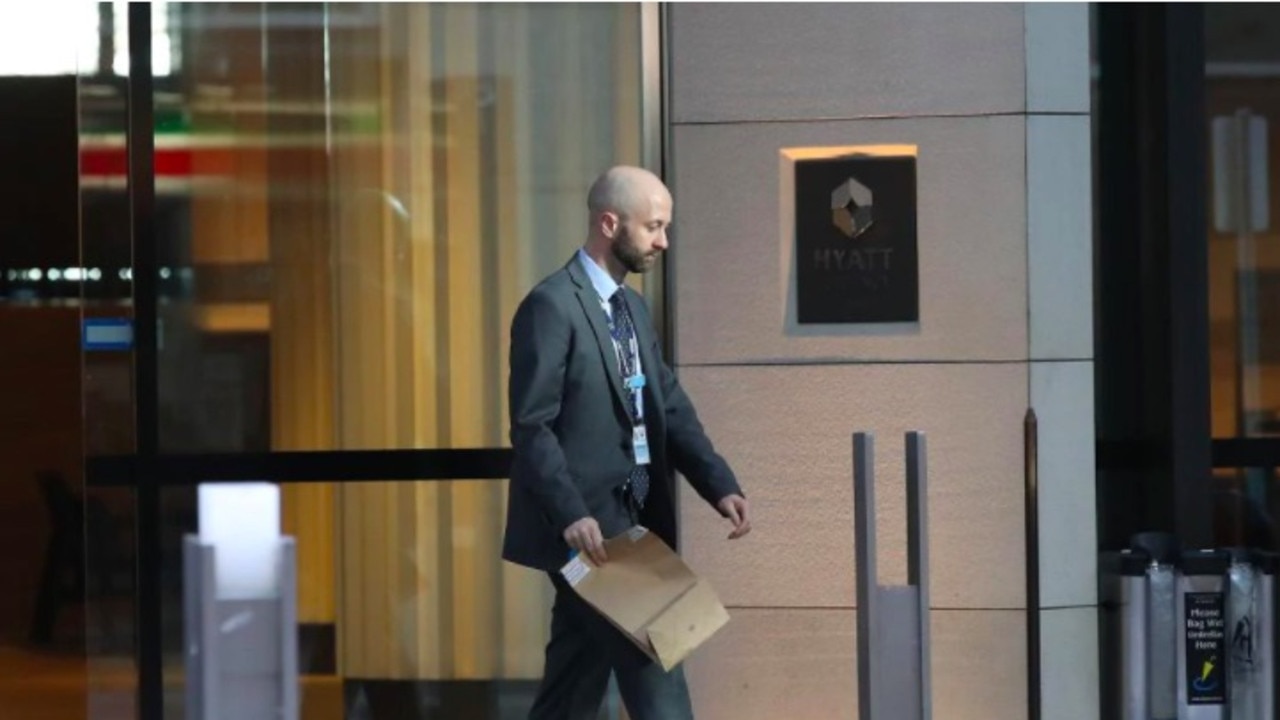 A detective leaves the hotel this morning. Picture: David Swift