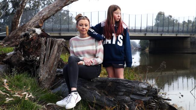 Emma Reid with daughter Poppy beside the Murray River. Picture: Aaron Francis