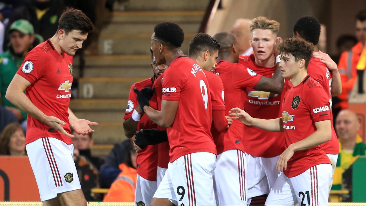 Scott McTominay celebrates with team mates after scoring his side’s first goal.