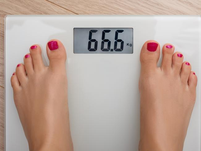 Digital bathroom scale showing 66.6 kg, bathroom scales generic