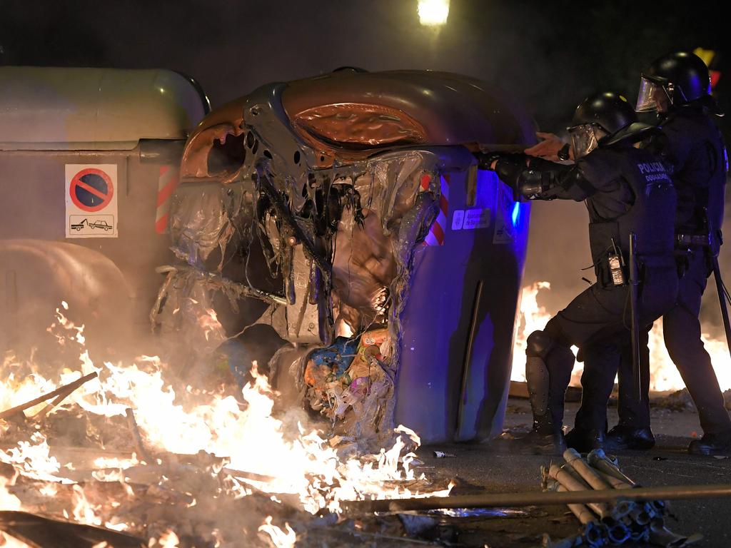 A melted skip used as a barricade by protesters. Picture: AFP