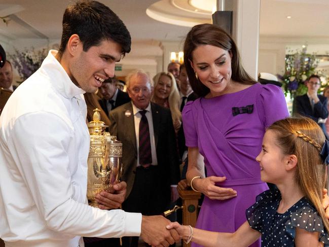 Winner Spain's Carlos Alcaraz shakes hands with Princess Charlotte of Wales and mum Catherine, Princess of Wales. Picture: Andrew Parsons/AFP