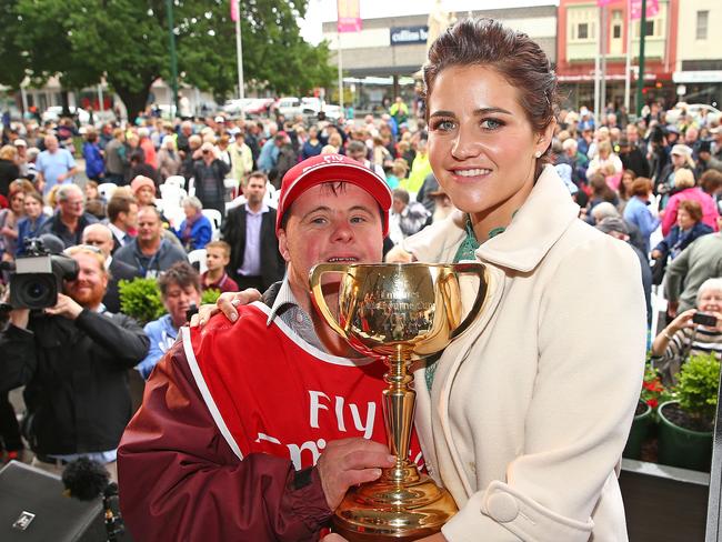 BALLARAT, AUSTRALIA - NOVEMBER 06: Jockey Michelle Payne and her brother Steven Payne, who has Down syndrome and works as a strapper pose with the cup after Michelle Payne riding Prince Of Penzance won the Emirates Melbourne Cup during the 2015 Melbourne Cup Community Celebration at Ballarat Town Hall on November 6, 2015 in Ballarat, Australia. (Photo by Scott Barbour/Getty Images)