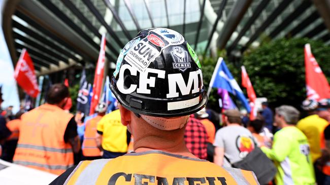 Members of the CFMEU protest outside the Queensland Government offices at 1 Williams Street in Brisbane on Thursday. Picture: NCA NewsWire / Dan Peled