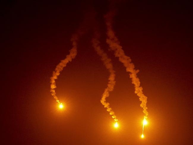 Israeli Defence Force flares light up the sky and landscape over Beit Hanoun, in the northern Gaza Strip. Picture: Getty Images