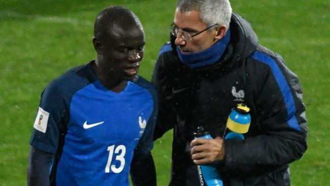 France's N'golo Kante (L) after his injury.