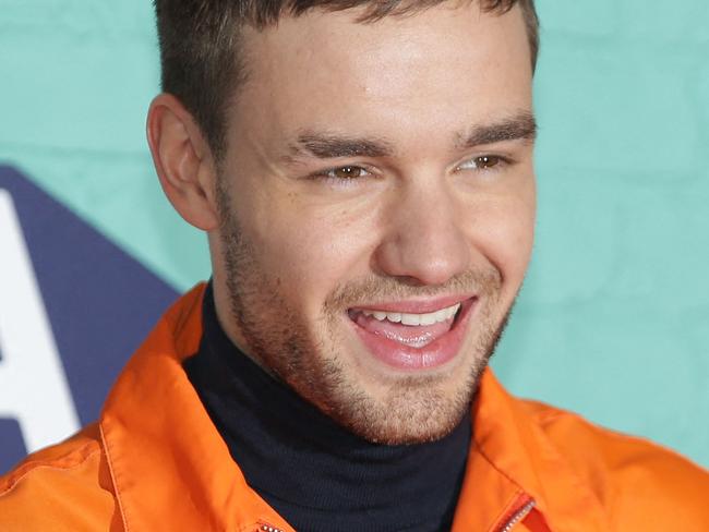 (FILES) British singer-songwriter Liam Payne poses on the red carpet arriving to attend the 2017 MTV Europe Music Awards (EMA) at Wembley Arena in London on November 12, 2017. Liam Payne, who died aged 31 after plunging from a hotel balcony in Buenos Aires, on October 16, 2024 spent more than half his life in the public eye as a member of one of the world's most successful boy bands. (Photo by Daniel LEAL / AFP)