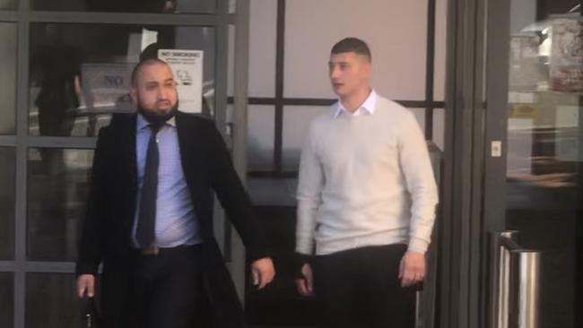 Mohammed Baltagi leaves Campbelltown Courthouse with his lawyer.