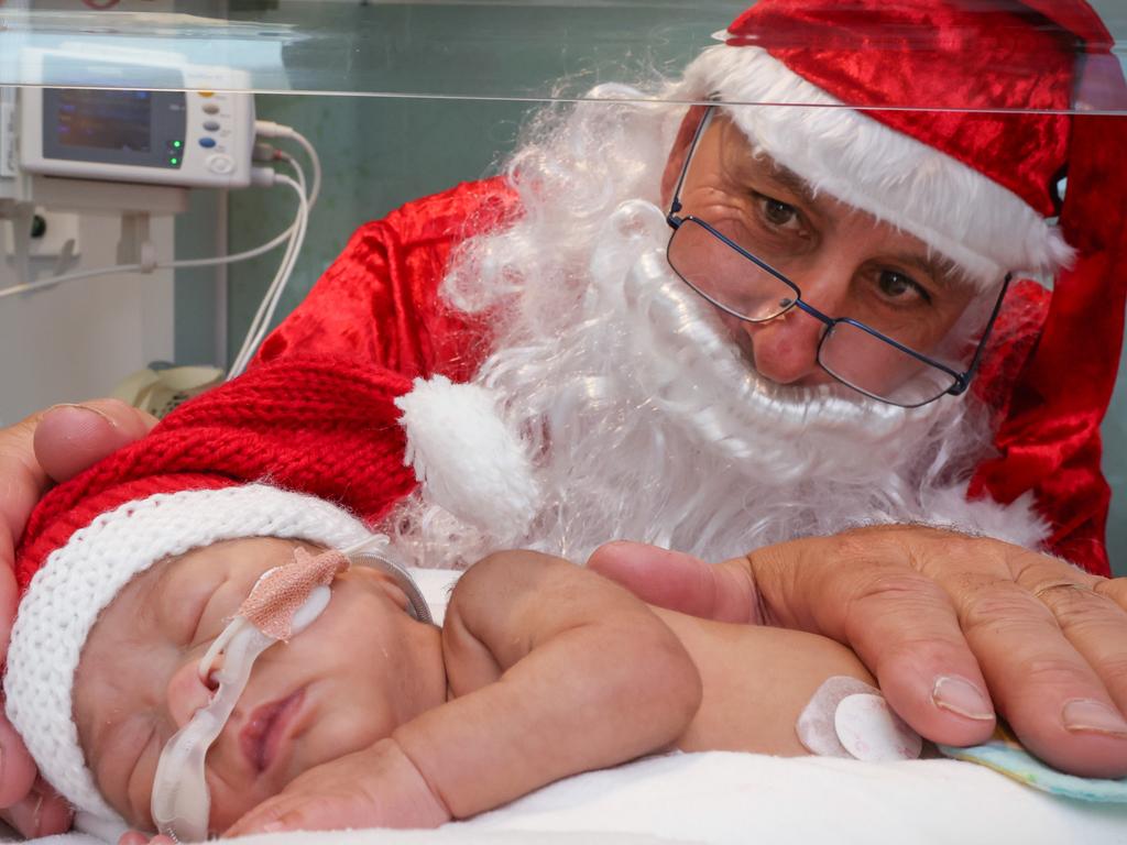 PJ Ng Souvanlasy is visited by Santa at the Joan Kirner Women’s and Children’s Hospital in Sunshine. Picture: David Caird