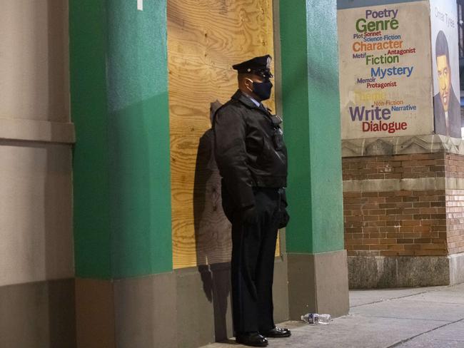 A police officer in front of a boarded up bank in Philadelphia, Pennsylvania. Picture: AFP