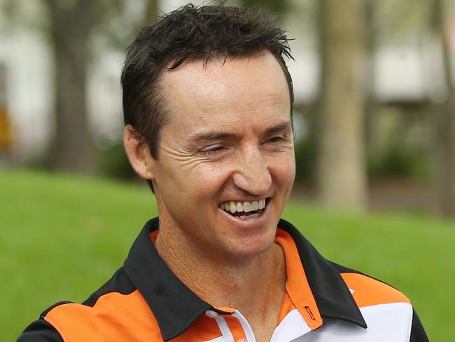 Wests Tigers coach Jason Taylor with some of his players. Wests Tigers season launch at Bicentennial Park, Homebush.