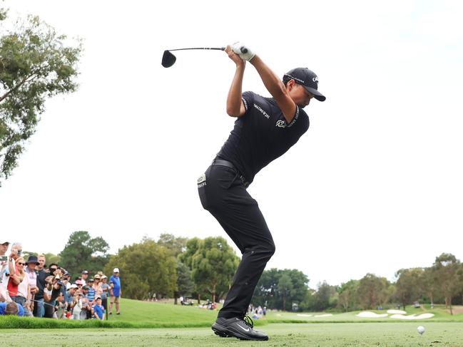 Min Woo Lee of Australia tees off on the 1st hole during the 2023 Australian Open. Picture: Matt King/Getty Images.