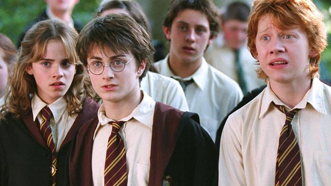 (L-R front) Emma Watson as Hermoine Granger, Daniel Radcliffe as harry potter and Rupert Grint as Ron Weazel in scene from 2004 film Happr Potter and the prisoner of Azkaban. movies actress actor hogwart's students