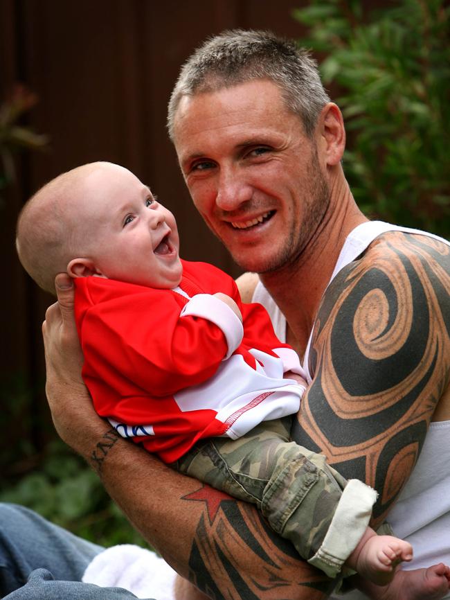 Sydney Swans AFL recruit Peter 'Spida' Everitt with his 4-month-old son Boston.