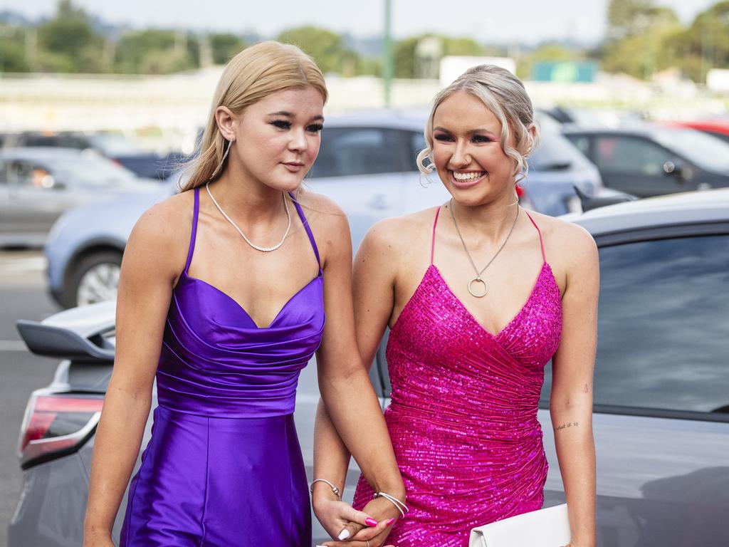 Graduate Elanore Santillan (right) is partnered by Gemma Ries at The Industry School formal at Clifford Park Racecourse, Tuesday, November 12, 2024. Picture: Kevin Farmer