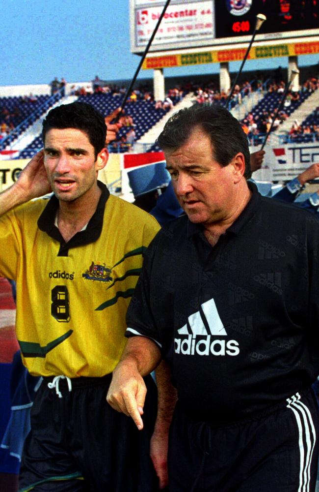 Soccer coach Terry Venables with player Mark Foster.