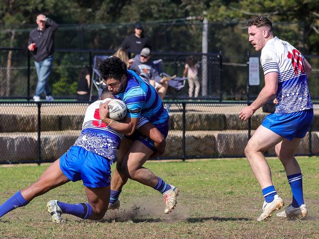 Sosifa Taufaao tackles Maila Aluni-Chanfoon while Maylee Semu looks on. Picture: Adam Wrightson Photography