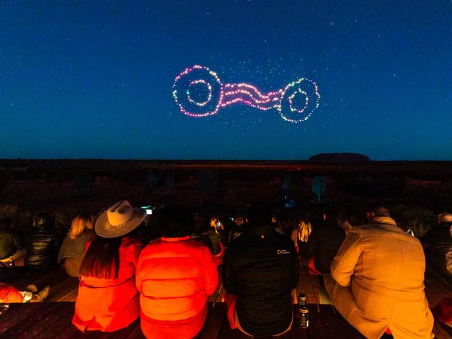 Drones light up the sky in the Wintjiri Wiru After Dark Show at Uluru. As custodians of the land, Anangu hold the Mala story from Kaltukatjara to Uluru. To share their story, RAMUS designed and produced an artistic platform using drones, light and sound to create an immersive storytelling experience. Picture: Supplied