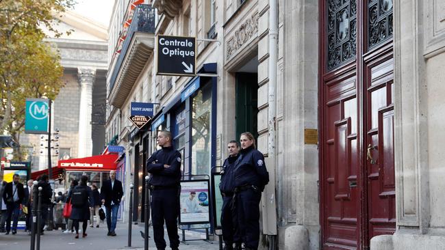 Police officers standing guard at the entrance to a hotel residence at the Rue Tronchet, near Madeleine, central Paris, where Kim Kardashian was robbed at gunpoint by assailants disguised as police.