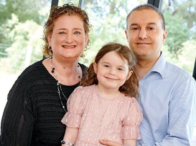 Harris Schneiderman, from Melbourne, with Gabrielle Goldberg and their daughter Eloise Goldberg. The family have saved from shopping around for private health insurance.