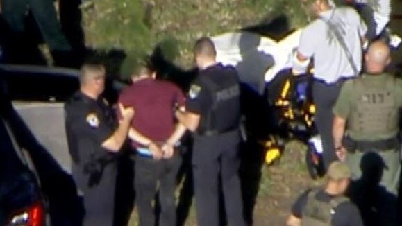 Nikolas Cruz is seen being led away by police. Picture: CNN.