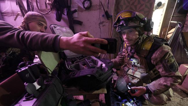 Ukrainian soldiers prepare a drone in a hideout on the frontline of the Donetsk region. Picture: AFP