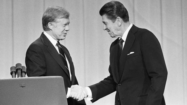 Carter and Republican challenger Ronald Reagan before their debate in 1980.