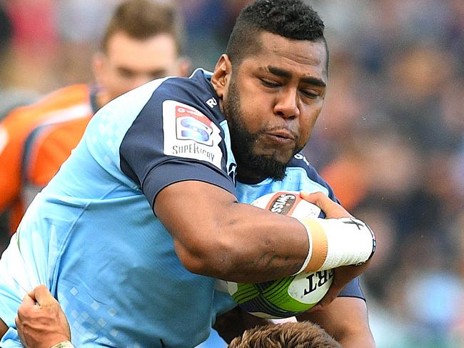 Taqele Naiyaravoro of the Waratahs fends off a tackle by George Bridge of the Crusaders to score a try during the Round 6 Super Rugby match between the NSW Waratahs and the Crusaders at Allianz Stadium in Sydney, Sunday, April 2, 2017. (AAP Image/Dan Himbrechts) NO ARCHIVING, EDITORIAL USE ONLY