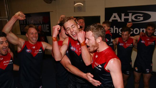 Oscar McDonald and Mitch White sing the song after Melbourne beat the GWS Giants in 2015. Picture: Colleen Petch.