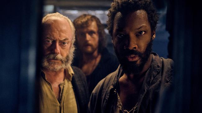 Liam Cunningham, Chris Walley and Corey Hawkins in The Last Voyage of the Demeter.