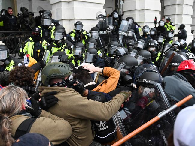 Riot police push back a crowd of supporters of US President Donald Trump after they stormed the Capitol building. Picture: Roberto Schmidt/AFP