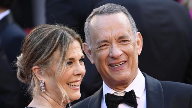 Messages that show the state executive making jokes about actor Tom Hanks, pictured with Rita Wilson at the Cannes film festival, shows how unaware they were about the NSW council election debacle. Picture: Gareth Cattermole/Getty Images.