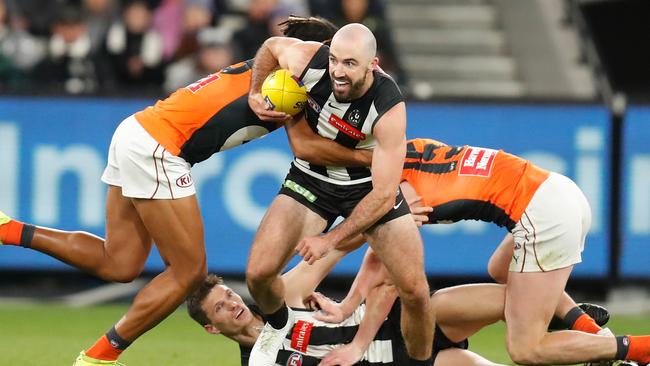 MELBOURNE, AUSTRALIA – APRIL 10: Steele Sidebottom of the Magpies is tackled by Connor Idun of the Giants during the 2021 AFL Round 04 match between the Collingwood Magpies and the GWS Giants at the Melbourne Cricket Ground on April 10, 2021 in Melbourne, Australia. (Photo by Michael Willson/AFL Photos via Getty Images)