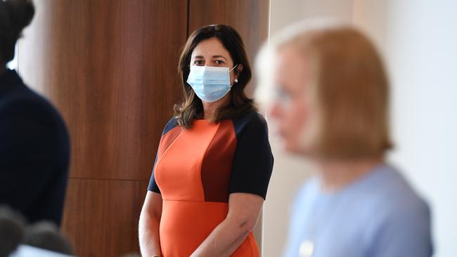 Queensland Premier Annastacia Palaszczuk (left) watches Chief Health Officer Dr Jeanette Young during a press conference. Picture: NCA NewsWire / Dan Peled