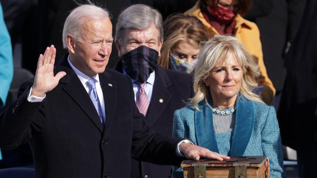 Joe Biden places his hand on the Bible as he is sworn in as the 46th president of the United States. Picture: Alex Wong/Getty Images