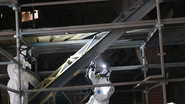 Workers spray painting the bridge to prevent rusting. Picture: Brisbane City Council