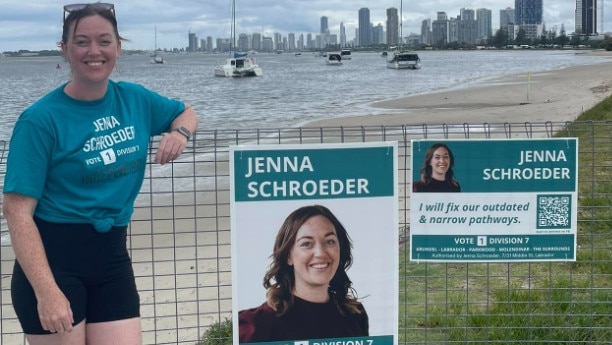 Jenna Schroeder, Division 7 candidate in the Gold Coast City Council 2024 election, fixing her corflutes after vandals targeted her campaign.