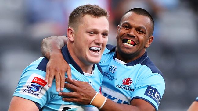 SYDNEY, AUSTRALIA - FEBRUARY 28: Angus Bell and Kurtley Beale of the Waratahs celebrate Bell scoring a try during the round five Super Rugby match between the Waratahs and the Lions at Bankwest Stadium on February 28, 2020 in Sydney, Australia. (Photo by Mark Kolbe/Getty Images)