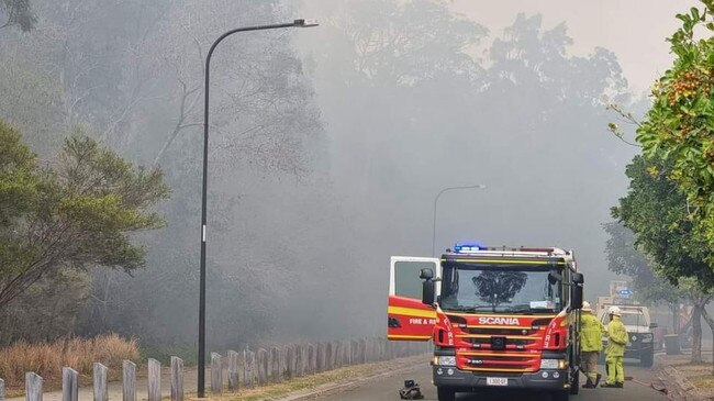 Emergency services are battling to contain a two hectare blaze at Thornlands, as Redland residences fill with smoke.