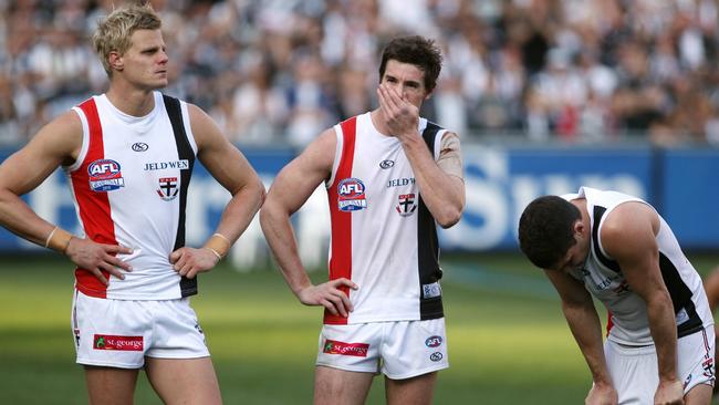 Nick Riewoldt, Lenny Hayes and Leigh Montagna after the 2010 Grand Final replay.