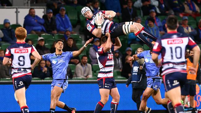 Murray Douglas of the Rebels catches the ball at nib Stadium.