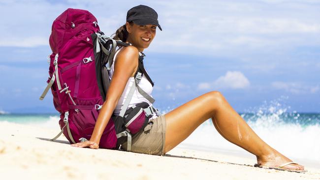 ESCAPE TRAVEL BUDDIES: A solo traveler backpacker on the beach. Picture: Thinkstock