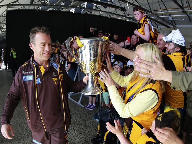 Hawthorn coach Alastair Clarkson holds aloft the AFL Premiership Cup for Hawks fans gathered at PW1 in Hobart. Picture: LEIGH WINBURN