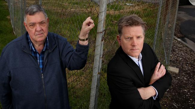 Powerlines and unfinished costruction in Waverley Park are still an issue as no decision has still been made about whether Mirvac will have to put them underground. Waverley park Action Group president John Lourens and Cr Robert Davies want action taken. Picture: Brendan Francis