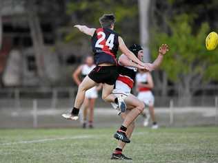 DRESS REHEARSAL: Jay Andrew spoils the mark of Brothers Bulldogs Jack Sickerdick. Picture: Cody Fox