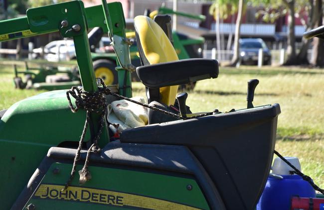 A Darwin Council contractor who was riding this lawnmower is in hospital after being struck by a piece of reinforced steel launched by another lawnmower. Picture: Raphaella Saroukos