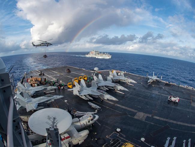 US aircraft carrier USS Carl Vinson participating in a replenishment-at-sea exercise while patrolling the South China Sea. Picture: AFP/US Navy