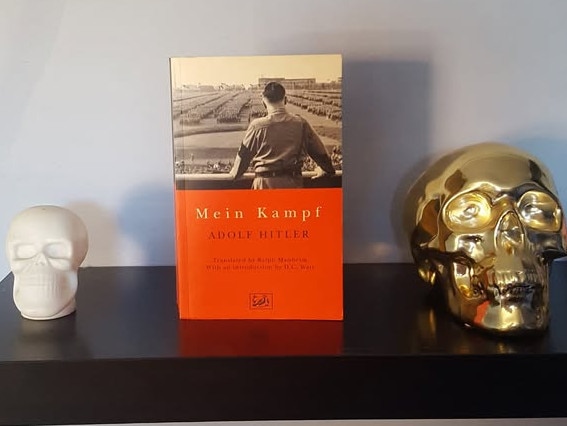 A photo of Mein Kampf in a post by Akca's friend ‘Ronny’, liked by Sayet Erhan Akca.