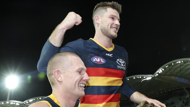 Bryce Gibbs gets chaired off after his 250th game by Sam Jacobs and Rory Sloane. Picture SARAH REED