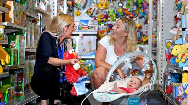 Lucy Cardus, with daughter Isobel Cardus, 11 weeks, talks to Debbie Flynn of the Baby Bunting store in Fortitude Valley. Picture: AAP Image